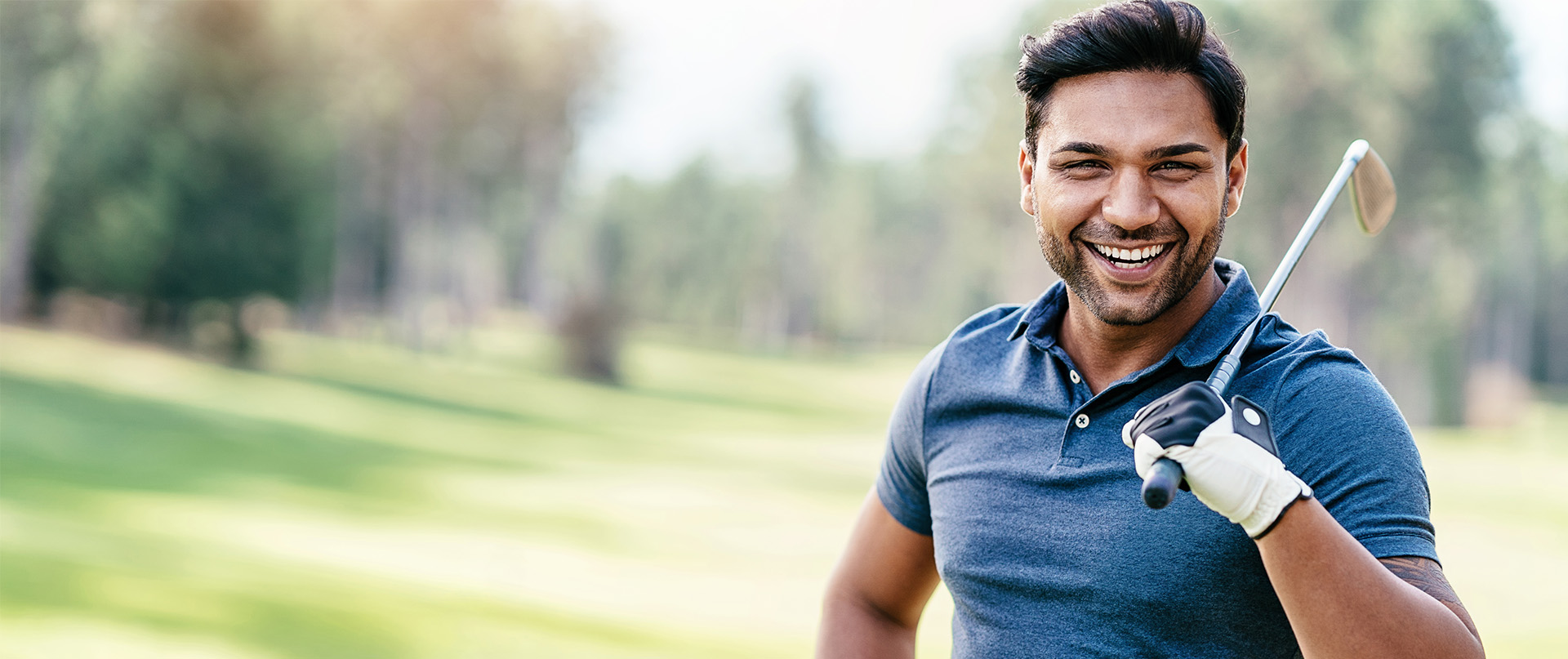 man holding golf club