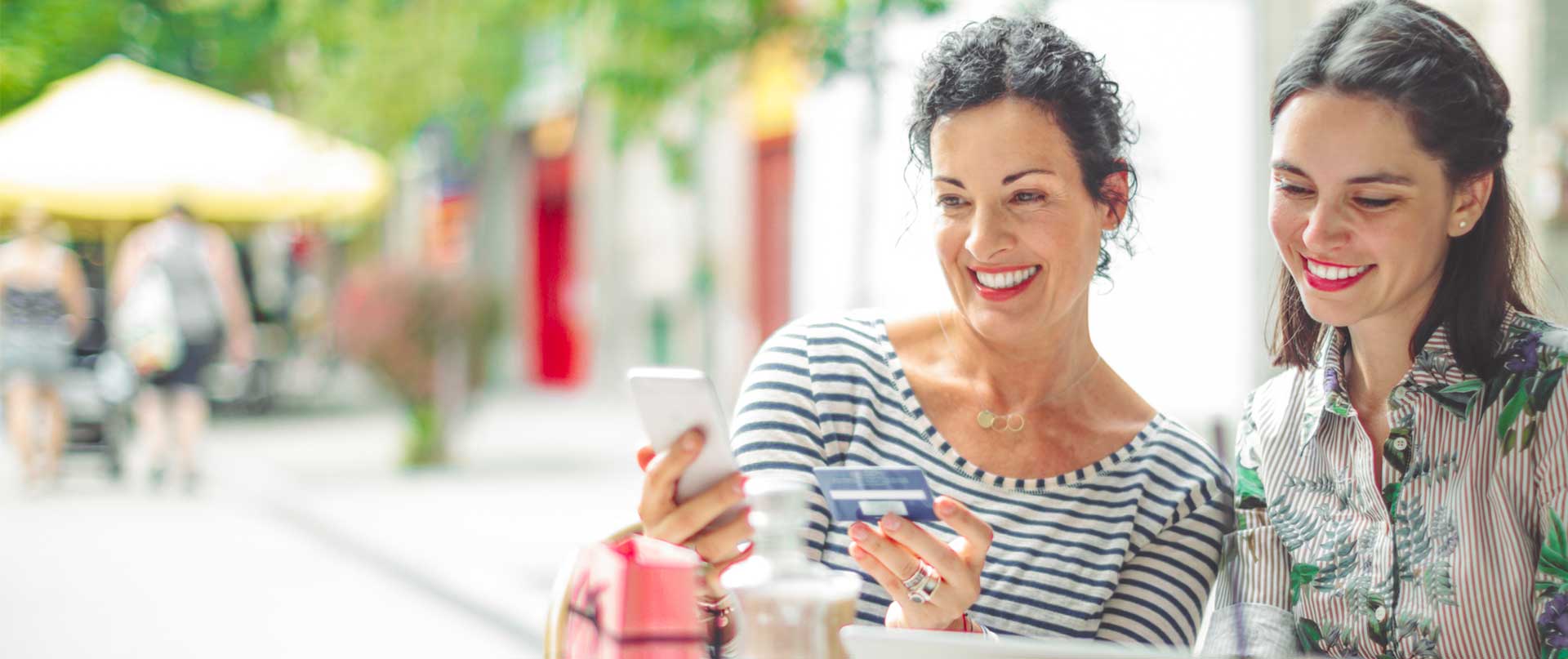 women paying with credit card