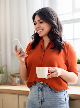 woman with phone and coffee