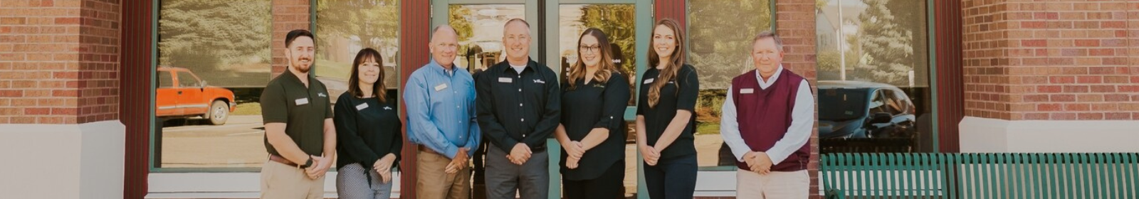 First FarmBank team members in front of St. Michael's Branch location.