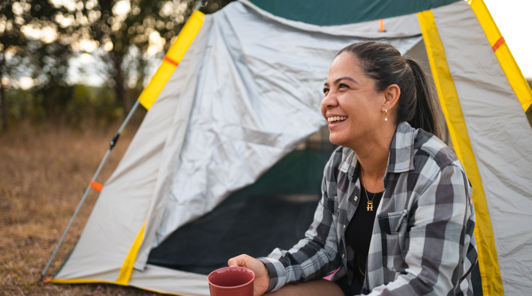 woman sitting in tent